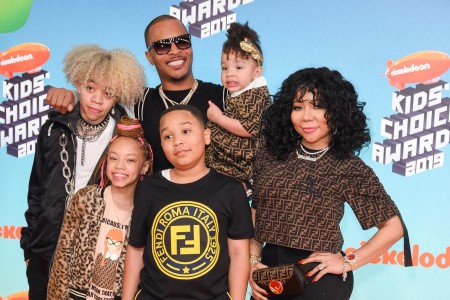 A photo of TI with his wife and children.